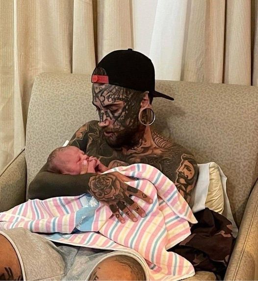 A 24-year-old father, who has several tattoos all over his body